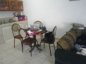 Standing at the entertainment centre looking towards my makeshift work table.