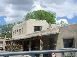 The top of the building is lined with glass telephone pole insulators.